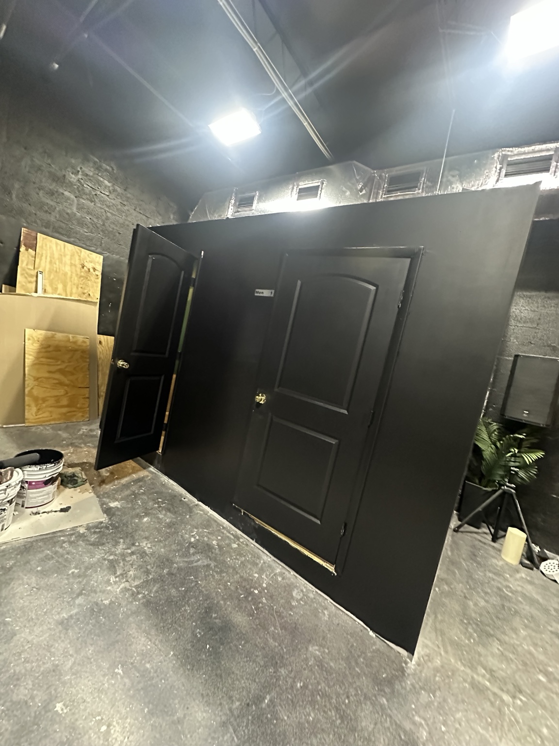 Finished commercial bathroom enclosure with doors