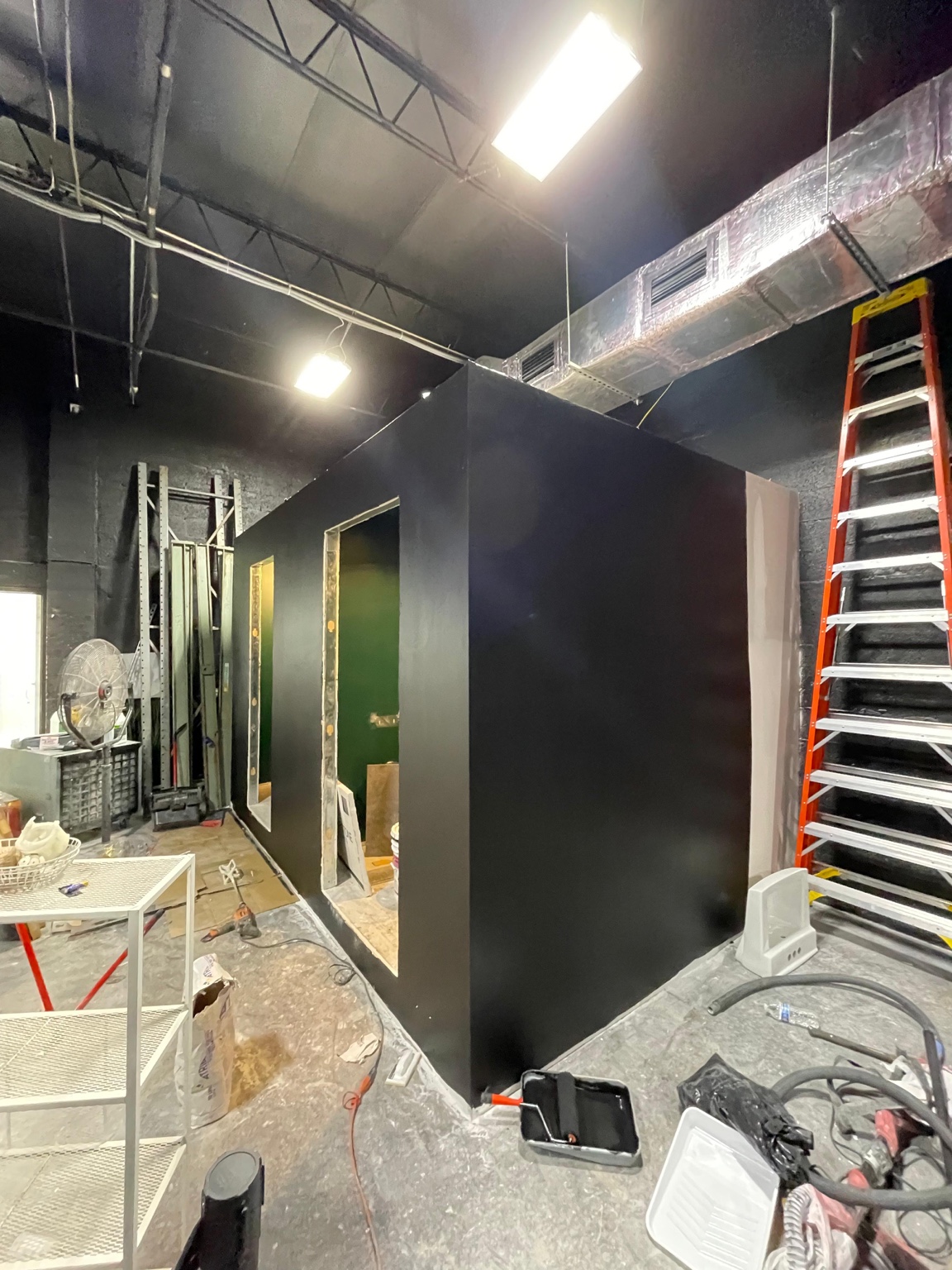 Commercial bathroom enclosure with finished drywall and paint
