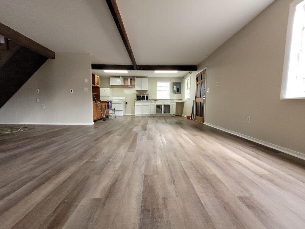 Completed open living area with new flooring