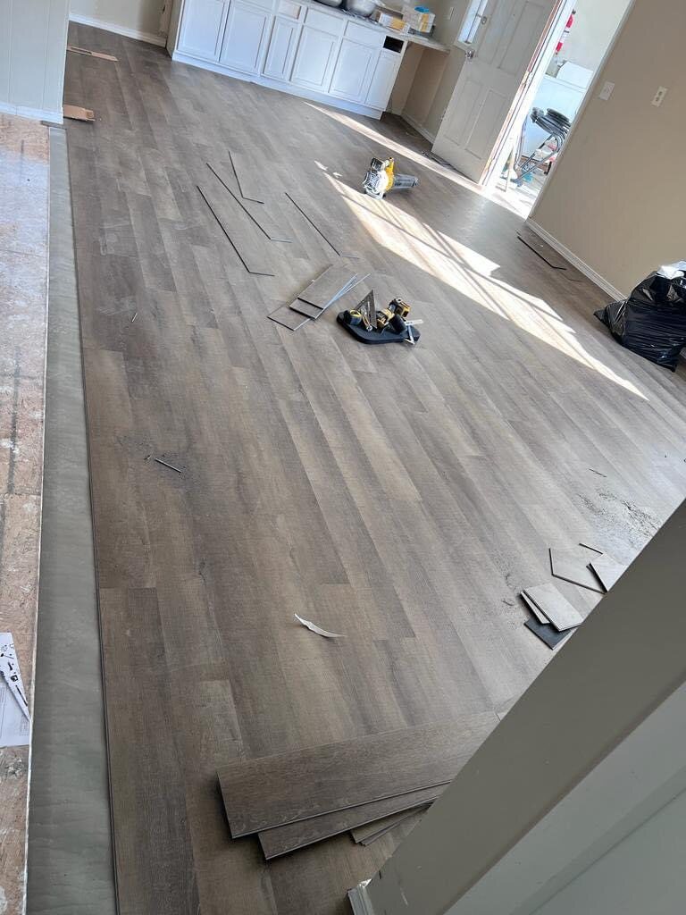 Vinyl plank flooring installation in progress