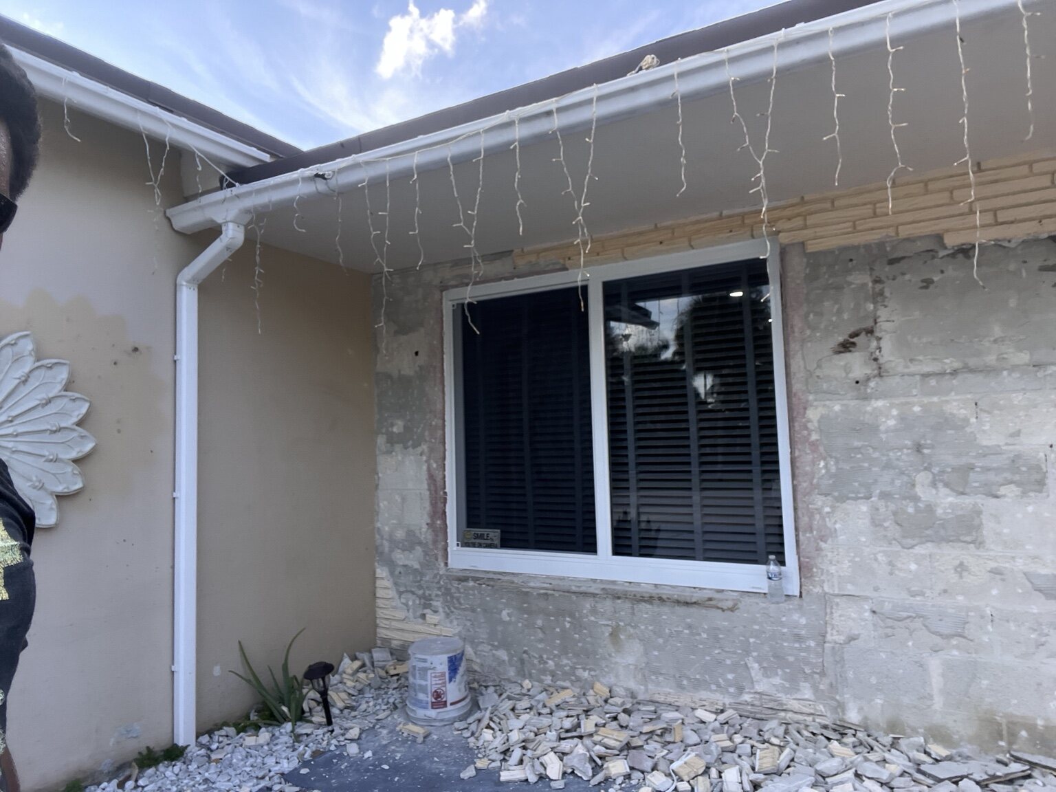 Exterior wall demolition around a window