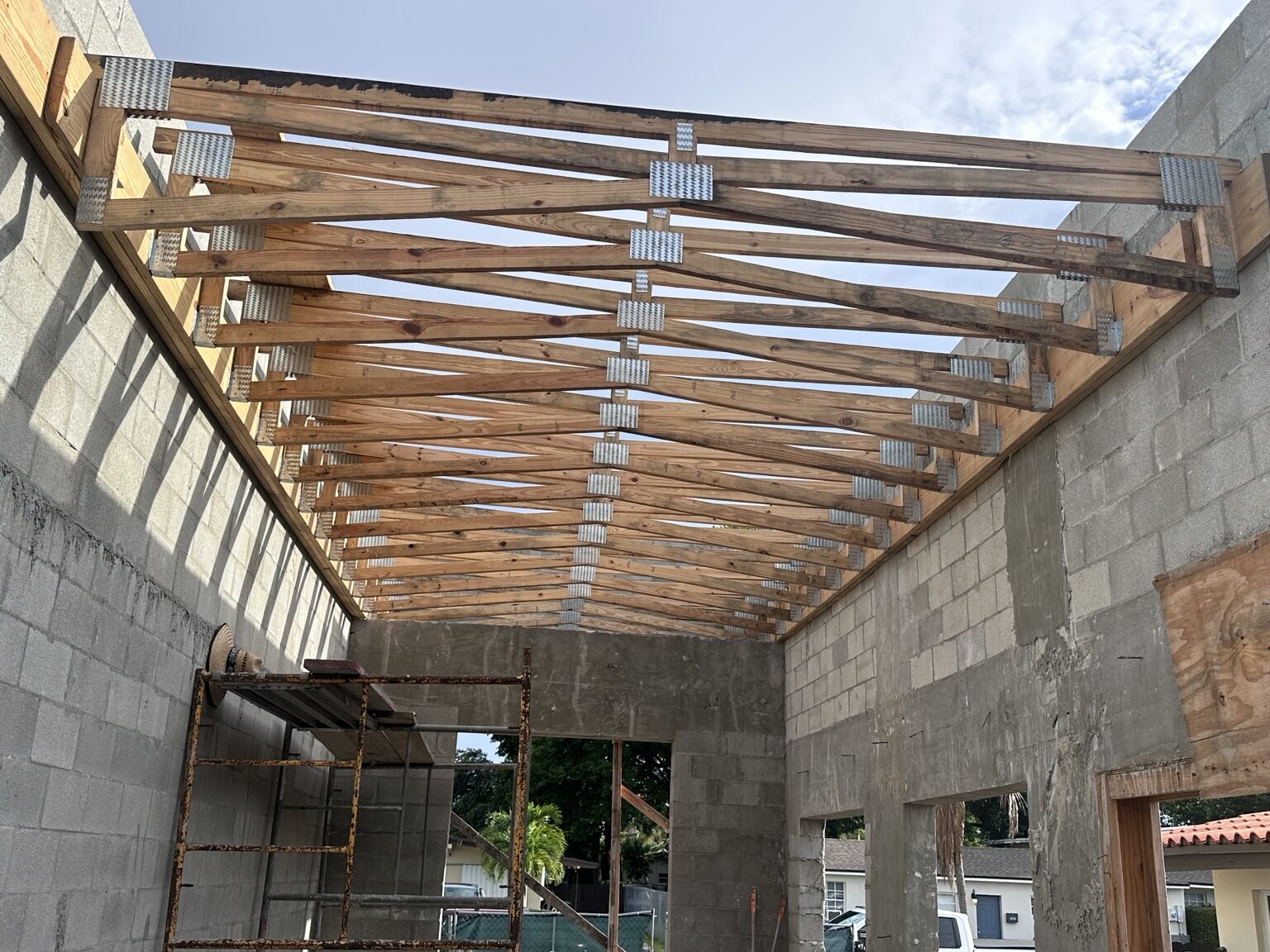 Complete wood truss system inside a block structure