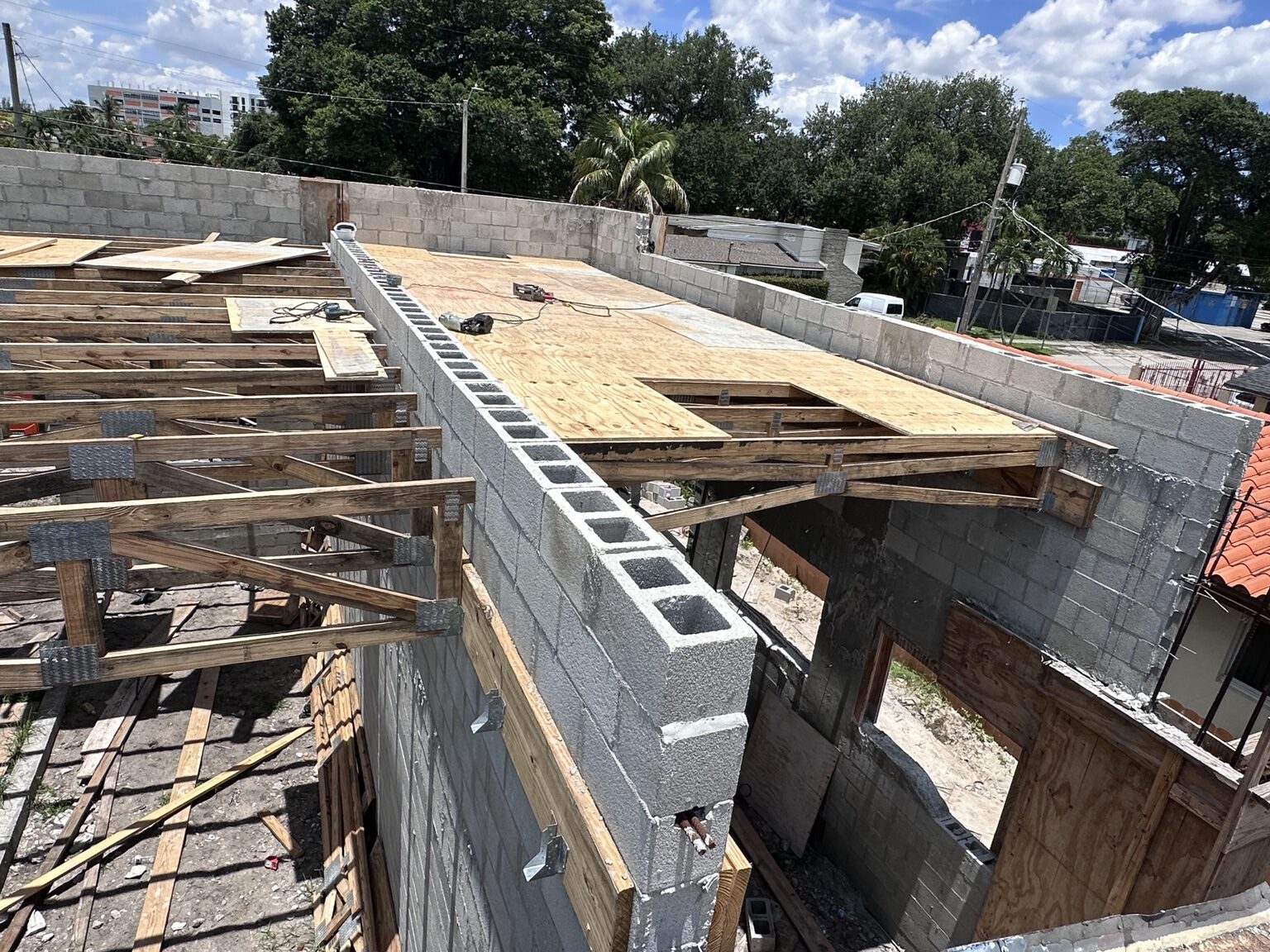 Plywood roof decking installed over wood trusses