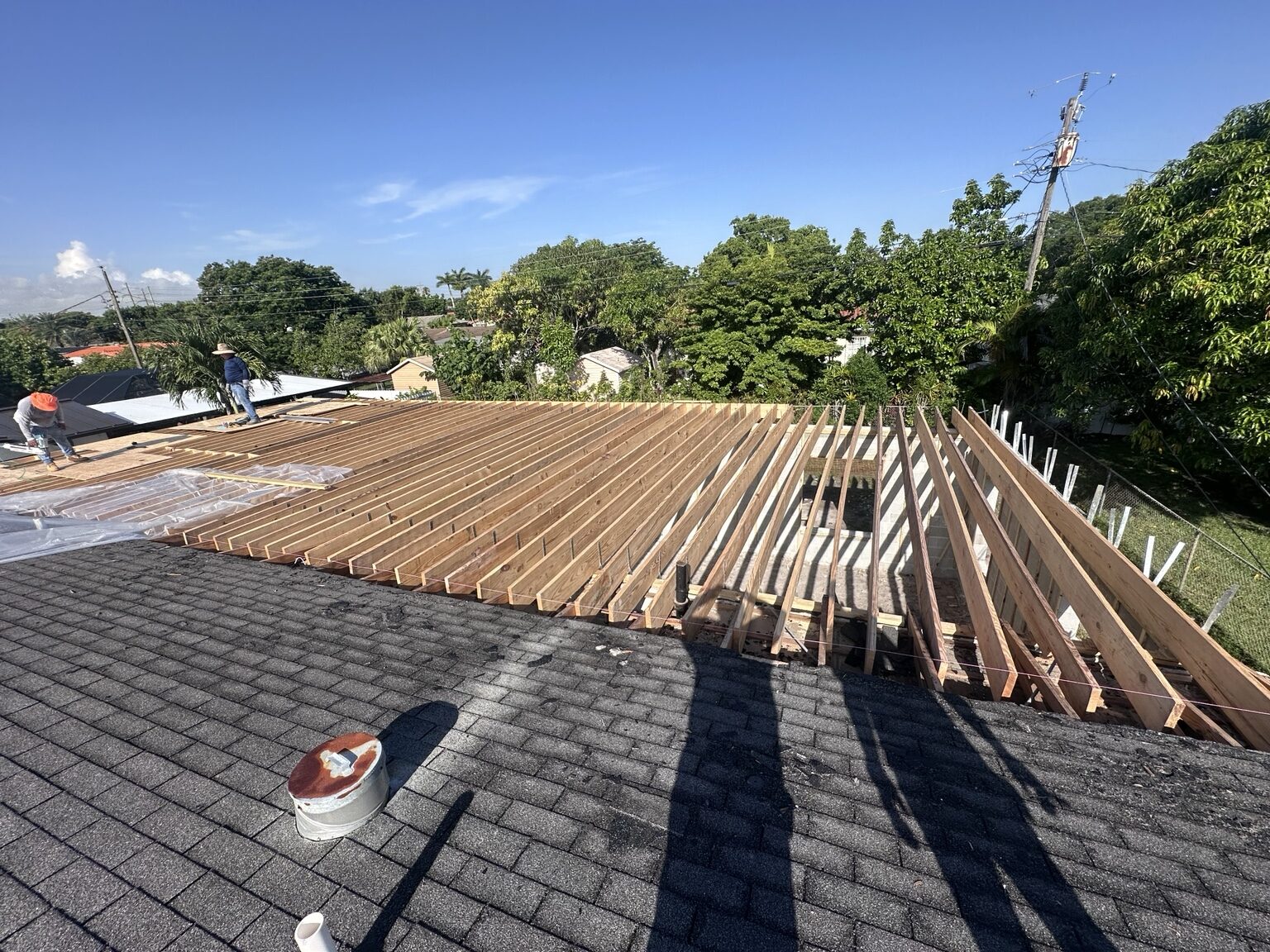 Large residential roof framed with wood rafters