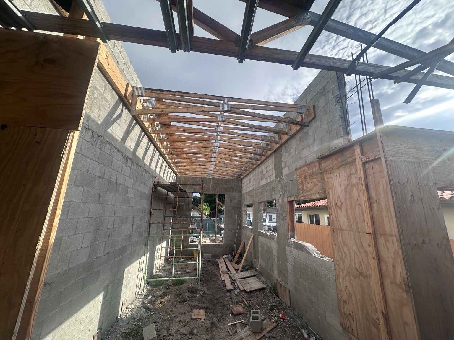 Wood roof trusses installed over concrete block walls