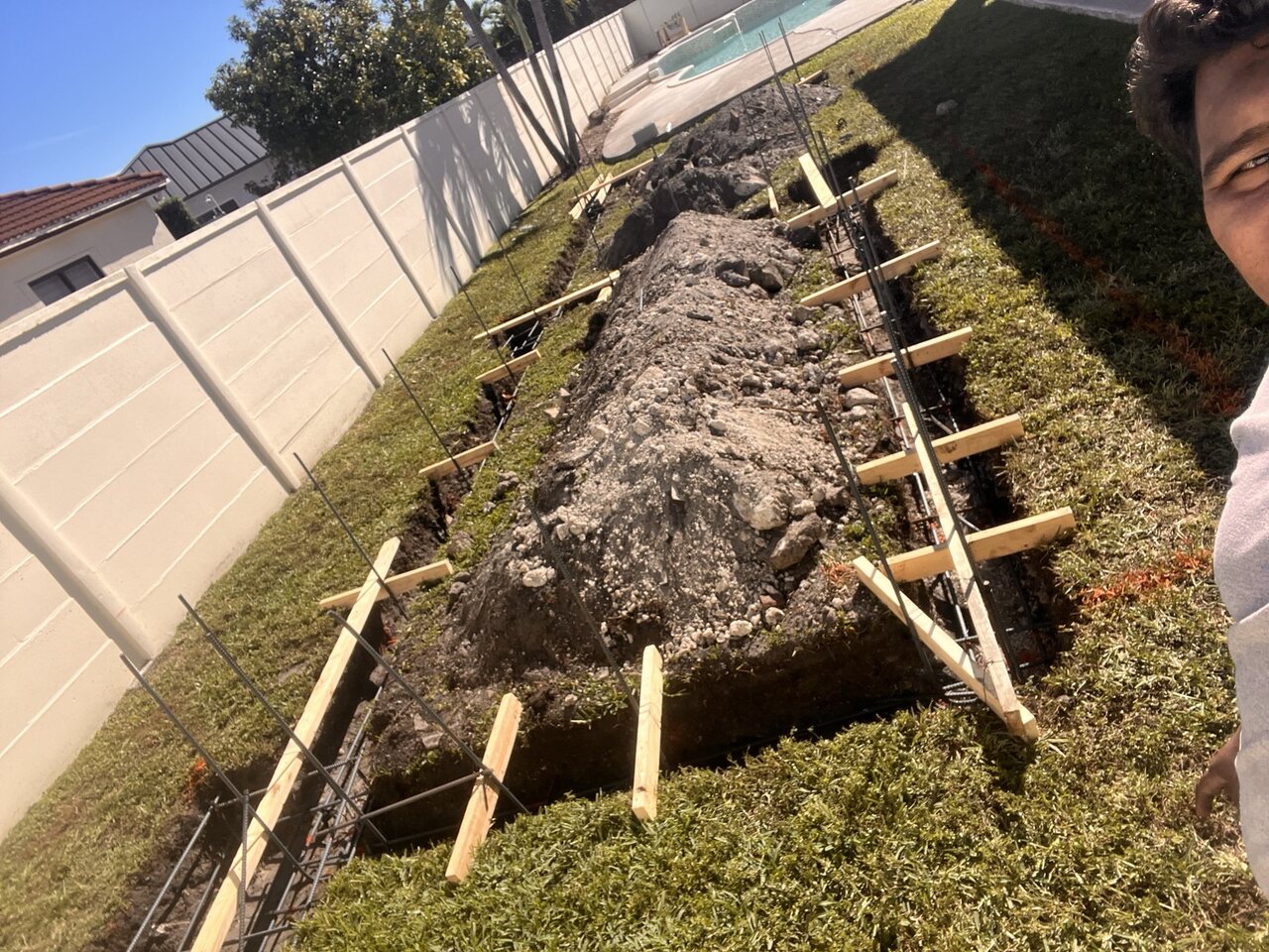 Excavated footing with reinforcing steel